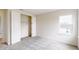Bright bedroom featuring grey carpet and a spacious closet at 3659 Tea Leaf Aly, Land O Lakes, FL 34638