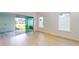 Light-filled living room with sliding doors to the patio at 3659 Tea Leaf Aly, Land O Lakes, FL 34638