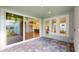 Spacious lanai with sliding glass doors leading to backyard at 3659 Tea Leaf Aly, Land O Lakes, FL 34638