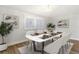 Modern dining room featuring a marble table and white chairs at 206 E Frierson Ave, Tampa, FL 33603
