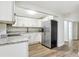 Updated kitchen, featuring white cabinets and stainless steel appliances at 206 E Frierson Ave, Tampa, FL 33603