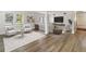 Living room with comfortable seating and wood-look floors at 206 E Frierson Ave, Tampa, FL 33603