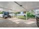Covered patio with tiled flooring, creating an outdoor entertaining space at 1215 S Keene Rd, Clearwater, FL 33756
