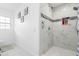 Clean bathroom with marble shower and grab bar at 1215 S Keene Rd, Clearwater, FL 33756