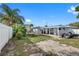 Spacious backyard offering a covered patio and ample green space at 1215 S Keene Rd, Clearwater, FL 33756
