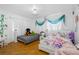 Spacious bedroom with two beds and decorative accents at 1215 S Keene Rd, Clearwater, FL 33756
