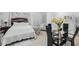 Bright bedroom with a double bed and a small sitting area at 1215 S Keene Rd, Clearwater, FL 33756
