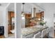 Kitchen island with granite countertop and seating for four at 1215 S Keene Rd, Clearwater, FL 33756