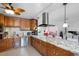 Spacious kitchen with granite countertops and modern appliances at 1215 S Keene Rd, Clearwater, FL 33756