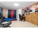 Multi-functional bedroom with a bed, desk and sitting area at 1215 S Keene Rd, Clearwater, FL 33756