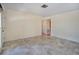 Spacious living room with tile floors and access to other areas of the home at 5390 Magnolia N Trl, Pinellas Park, FL 33782