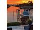 Waterfront backyard view showcases a private dock and boat lift on the canal at 406 Islebay Dr, Apollo Beach, FL 33572