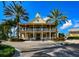 Beautiful two-story clubhouse with dual balconies and lush tropical landscaping at 406 Islebay Dr, Apollo Beach, FL 33572