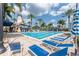 Community pool featuring a lighthouse, waterslide, and poolside loungers at 406 Islebay Dr, Apollo Beach, FL 33572