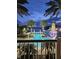 Resort-style pool with palm trees, lighthouse and waterslide at 406 Islebay Dr, Apollo Beach, FL 33572