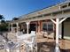 Inviting outdoor patio with comfortable seating and lake views at 406 Islebay Dr, Apollo Beach, FL 33572