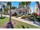 House with a front porch and walkway, surrounded by palm trees at 406 Islebay Dr, Apollo Beach, FL 33572