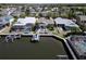 Aerial view of home, backyard, boat lift and canal at 406 Islebay Dr, Apollo Beach, FL 33572