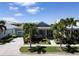 House with driveway, landscaping, and palm trees at 406 Islebay Dr, Apollo Beach, FL 33572