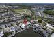 Aerial view of a waterfront community with houses and canals at 406 Islebay Dr, Apollo Beach, FL 33572