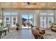 Sunroom with water views, wicker furniture, and a relaxing atmosphere at 406 Islebay Dr, Apollo Beach, FL 33572