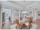 Formal dining room with hardwood floors and a view of the entryway and living areas at 406 Islebay Dr, Apollo Beach, FL 33572