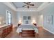 Main bedroom with hardwood floors, king-size bed, and ceiling fan at 406 Islebay Dr, Apollo Beach, FL 33572