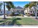 House with a front porch and walkway, surrounded by palm trees at 406 Islebay Dr, Apollo Beach, FL 33572