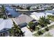 Aerial view highlighting a house with gray-blue exterior and canal access at 406 Islebay Dr, Apollo Beach, FL 33572