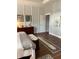 Main bedroom with hardwood floors, king-size bed, and walk-in closet at 406 Islebay Dr, Apollo Beach, FL 33572