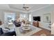 Relaxing living room with hardwood floors, a ceiling fan, and comfortable seating at 406 Islebay Dr, Apollo Beach, FL 33572