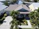 House exterior, gray roof, light blue walls, and palm trees at 406 Islebay Dr, Apollo Beach, FL 33572