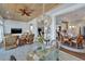Sunroom features wicker furniture, a view of the kitchen and dining areas at 406 Islebay Dr, Apollo Beach, FL 33572