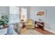 Home office with hardwood floors, comfortable seating, and built-in shelving at 406 Islebay Dr, Apollo Beach, FL 33572
