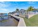 Direct canal access with a concrete walkway and seawall at 406 Islebay Dr, Apollo Beach, FL 33572