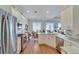 Modern kitchen featuring stainless steel appliances and hardwood floors at 406 Islebay Dr, Apollo Beach, FL 33572