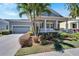 House with a front porch and walkway, surrounded by palm trees at 406 Islebay Dr, Apollo Beach, FL 33572