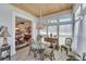 Sunlit dining room featuring a glass-top table and wicker chairs at 406 Islebay Dr, Apollo Beach, FL 33572