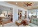 Bright sunroom with open views to living room, kitchen, and dining areas at 406 Islebay Dr, Apollo Beach, FL 33572