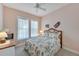 Guest bedroom with a queen-size bed and tropical decor at 406 Islebay Dr, Apollo Beach, FL 33572