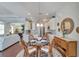 Charming dining room with a round glass table and wicker chairs at 406 Islebay Dr, Apollo Beach, FL 33572