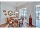 Bright dining area with a round table, wicker chairs, and water views at 406 Islebay Dr, Apollo Beach, FL 33572