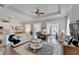 Spacious living room with hardwood floors, comfortable seating and a ceiling fan at 406 Islebay Dr, Apollo Beach, FL 33572