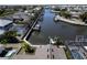 Aerial view showing canal-front property with boats and pool at 406 Islebay Dr, Apollo Beach, FL 33572