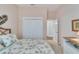Bright bedroom with double closets and access to hallway at 406 Islebay Dr, Apollo Beach, FL 33572