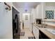 Modern kitchen with white cabinets, stainless steel appliances, and light countertops at 4221 W Spruce St # 2205, Tampa, FL 33607