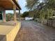 View of the backyard under construction with a view of the fence and the back of the patio at 4642 W Longfellow Ave, Tampa, FL 33629