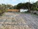 View of the backyard under construction with a partially visible fence at 4642 W Longfellow Ave, Tampa, FL 33629