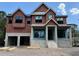 Two-story home under construction showing the concrete block foundation and framed window openings at 4642 W Longfellow Ave, Tampa, FL 33629