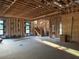 View of the living room showing the stairs to the second floor and framed fireplace at 4642 W Longfellow Ave, Tampa, FL 33629